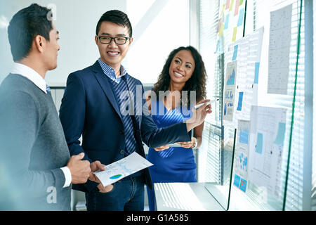 Asian business team working on new business strategy Stock Photo