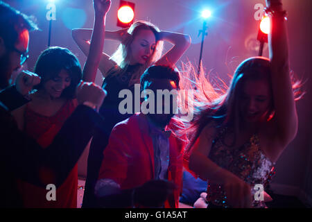 Multi-ethnic dancers enjoying party in night club Stock Photo
