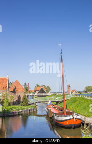 Old sailing ship in a canal in Enkhuizen, Netherlands Stock Photo