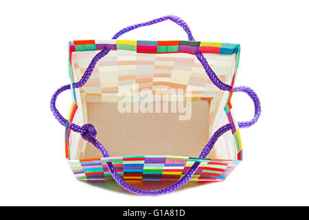 Above studio shot of open empty patterned colorful gift bag on white Stock Photo