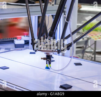 Industrial robot working in factory,Conveyor Tracking Controler of robotic hand. Stock Photo