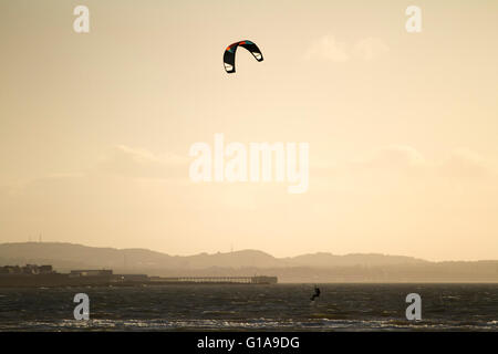 Kite Surfing at sunset Stock Photo