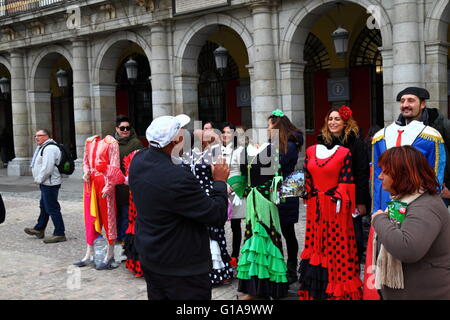 Tourists have their photo taken with mannequins in old fashioned costumes, Plaza Mayor, Madrid , Spain Stock Photo