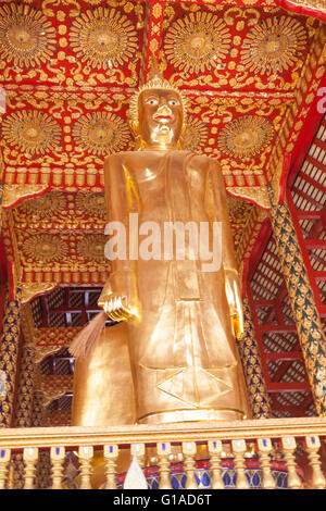 Statue of a golden Buddha at Wat Suan Dok University in Chiang Rai, Thailand Wat Phra Doi Suthep Stock Photo