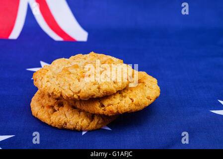 Traditional  Anzac biscuits on  Australian flag as background Stock Photo