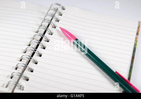 Empty page in spiral bound notebook with pencil Stock Photo