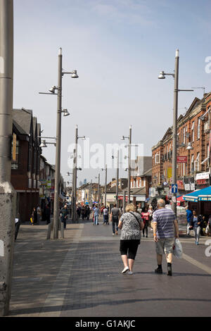 People walking in a pedestrianized street in multicultural Walthamstow market in east London, UK Stock Photo