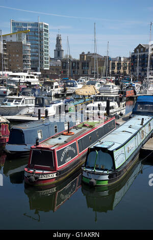 Views of yachts narrow boats and new luxury buildings at Limehouse Marina in east London, UK Stock Photo