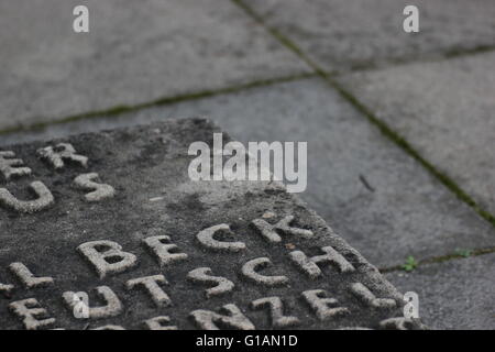 Detail of memorial for resistance fighters against National Socialism in WWII. Unidentifiable fragments of names can be seen. Stock Photo