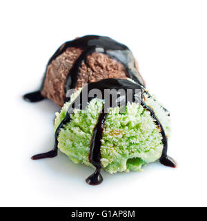 Two scoops of pistachio and chocolate ice cream isolated on white background Stock Photo