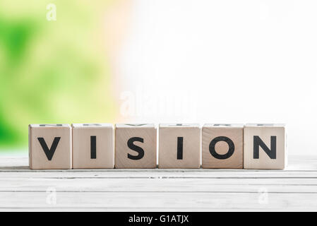 Vision sign made of wooden cubes on a desk Stock Photo