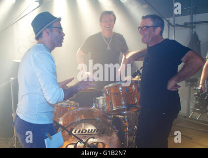 Seeshaupt, Germany. 7th May, 2016. dpa EXCLUSIVE - Tico Torres (R), drummer of the group Bon Jovi, Herman Rarebell (C), former drummer of the Scorpions and music video and film director Maik Marzuk (L) take part in a video shoot for Torres' fashion collection 'Rock Star Baby' in Seeshaupt, Germany, 7 May 2016. Hermann and Torres havbe known each other since the 1980s when Bon Jovi performed as the supporting act of the German music group Scorpions when they went on a four-months concert tour. Photo: Ursula Dueren/dpa/Alamy Live News Stock Photo