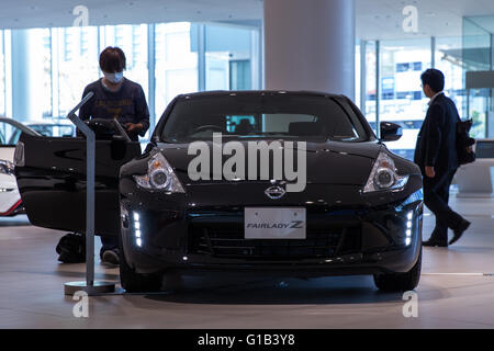 May 12, 2016, Yokohama, Japan - In this photo released on May 13, 2016, shows a visitor looking at a Nissan Fairlady Z car at the Nissan headquarter showroom in Yokohama, Japan. The Japanese automaker posted a $4.4 billion (523.8 billion yen) net income for FY 2015. (Photo by AFLO) Stock Photo