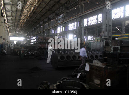 Laborers shut down the railway workshop during protest demonstration for increment in their monthly salaries, at Cantt Station in Karachi on Thursday, May 12, 2016. Stock Photo