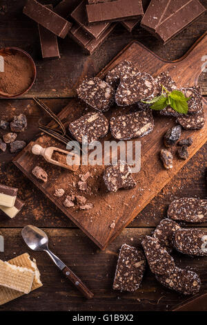 Top view of chocolate salami with biscuits Stock Photo