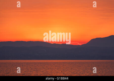 Sunset over the Garda lake from point of Sirmione town in Italy Stock Photo