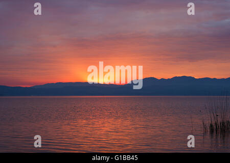 Sunset over the Garda lake from point of Sirmione town in Italy Stock Photo