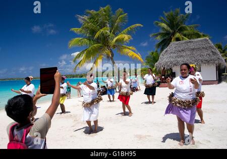 France, French Polynesia, Aranui 5 freighter and passenger ship cruise to the Marquesas archipelago, Port of call in Takapoto atoll, dances for the tourists performed by local amateur women Stock Photo