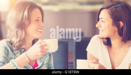 Two smiling students having a cup of coffee Stock Photo