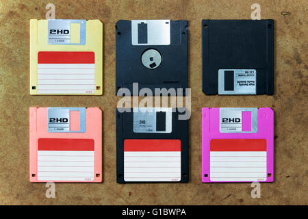 floppy disk in various colors. flat lay on wood board Stock Photo