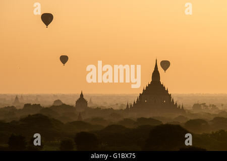 Hot air balloons in the sky during sunrise over the temples in Bagan, Myanmar Stock Photo