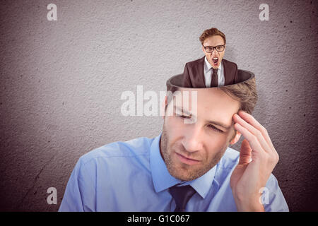 Composite image of young angry businessman shouting at camera Stock Photo