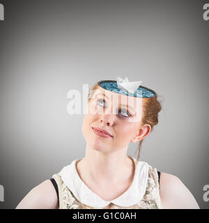 Composite image of hipster redhead looking up thinking Stock Photo