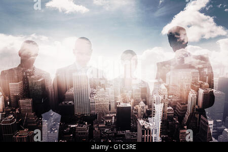 Composite image of business colleagues using their multimedia devices Stock Photo