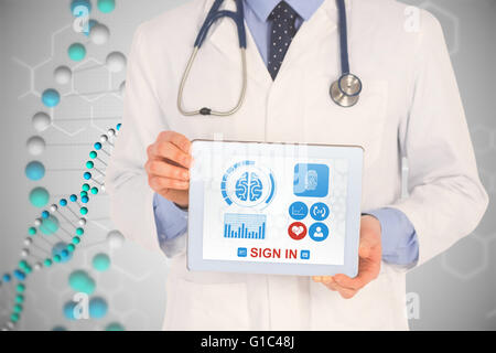 Composite image of doctor showing digital tablet on white background Stock Photo
