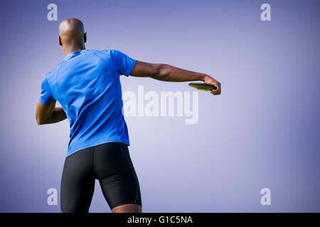 Composite image of rear view of discus pitcher Stock Photo