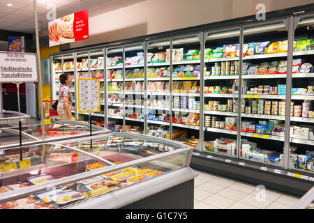 Refrigerater with glass front with fresh products in REWE supermarket Stock Photo