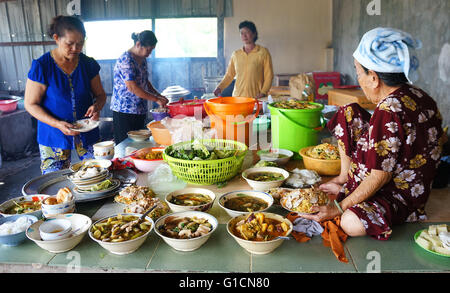 CAN GIO, VIET NAM, Group of Asia woman cook meal for festive day at kitchen, Vietnamese food in bowl, traditional eating,Vietnam Stock Photo