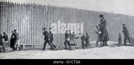 Russian prisoners outside a prison stockade in Siberia; Russia 1900 Stock Photo