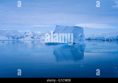 Serene iceberg drifting in the Neumayer Channel Stock Photo