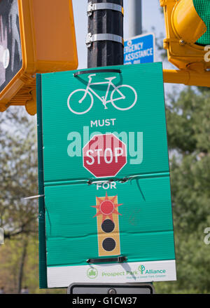 Sign cyclists must stop at red light Prospect Park, Brooklyn, New York, USA Stock Photo