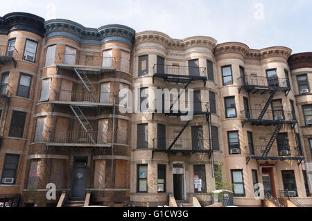 Boarded up apartments under development 14th Street, Brooklyn, New York, USA Stock Photo