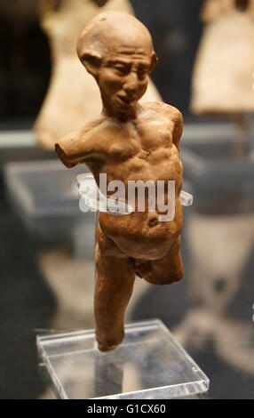 Terracotta figure of a grotesquely deformed and twisted man. Dated 1st Century BC Stock Photo