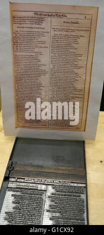 Metal plate with letters set to print a page from a reconstruction of a 16th Century printing press. Stock Photo