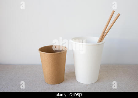 white and brown coffee paper cups with straws Stock Photo
