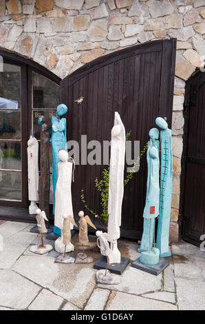 Wooden souvenir sculptures in shop exterior in Kazimierz Dolny, Poland, Europe, bohemian tourist travel destination, sightseeing Stock Photo