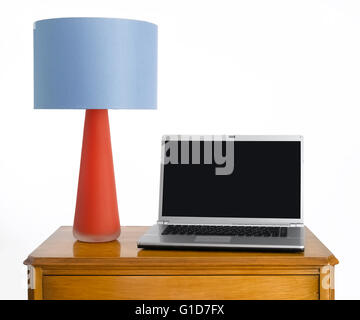 Lampshade on sideboard Stock Photo