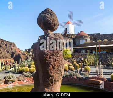 Cactus plants and windmill Jardin de Cactus designed by César Manrique, Guatiza, Lanzarote, Canary Islands, Spain Stock Photo