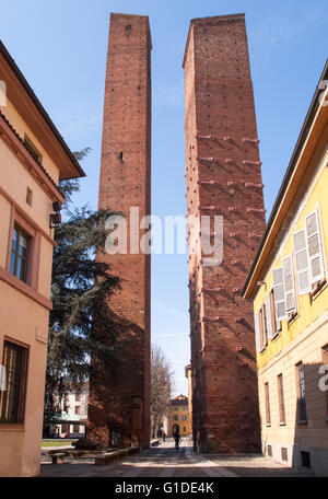 Pavia, Italy - March 8, 2015: Medieval towers in the historic center of the city. Especially the red brick used for the construc Stock Photo