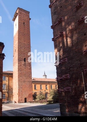 Pavia, Italy - March 8, 2015: Medieval towers in the historic center of the city. Especially the red brick used for the construc Stock Photo