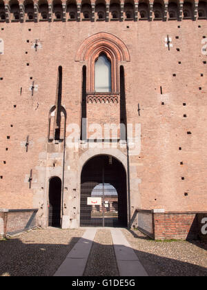 Pavia, Italy - March 8, 2015: Visconti Castle. Medieval building with red brick facades and a large garden mainsails. Steps unde Stock Photo