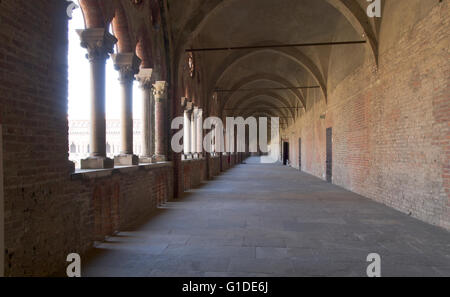 Pavia, Italy - March 8, 2015: Visconti Castle. Medieval building with red brick facades and a large garden mainsails. Steps unde Stock Photo