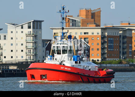 Tug ZP Bear, operated by KOTUG SMIT TOWAGE, heads up river to meet an ...