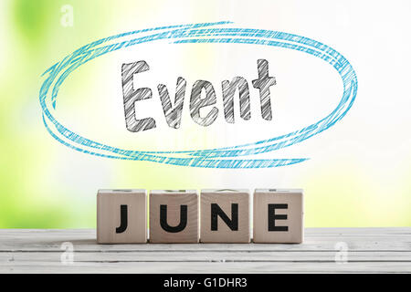 June event sign on a wooden stage on green background Stock Photo