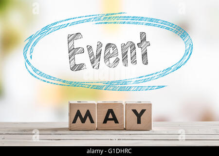 May event sign on a wooden table with text Stock Photo