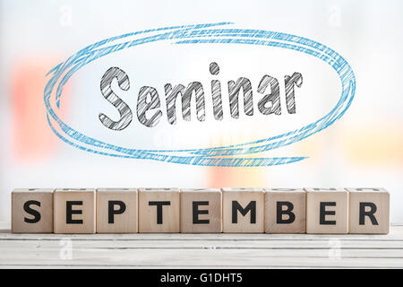 September seminar sign with blue sketch on a wooden stage Stock Photo